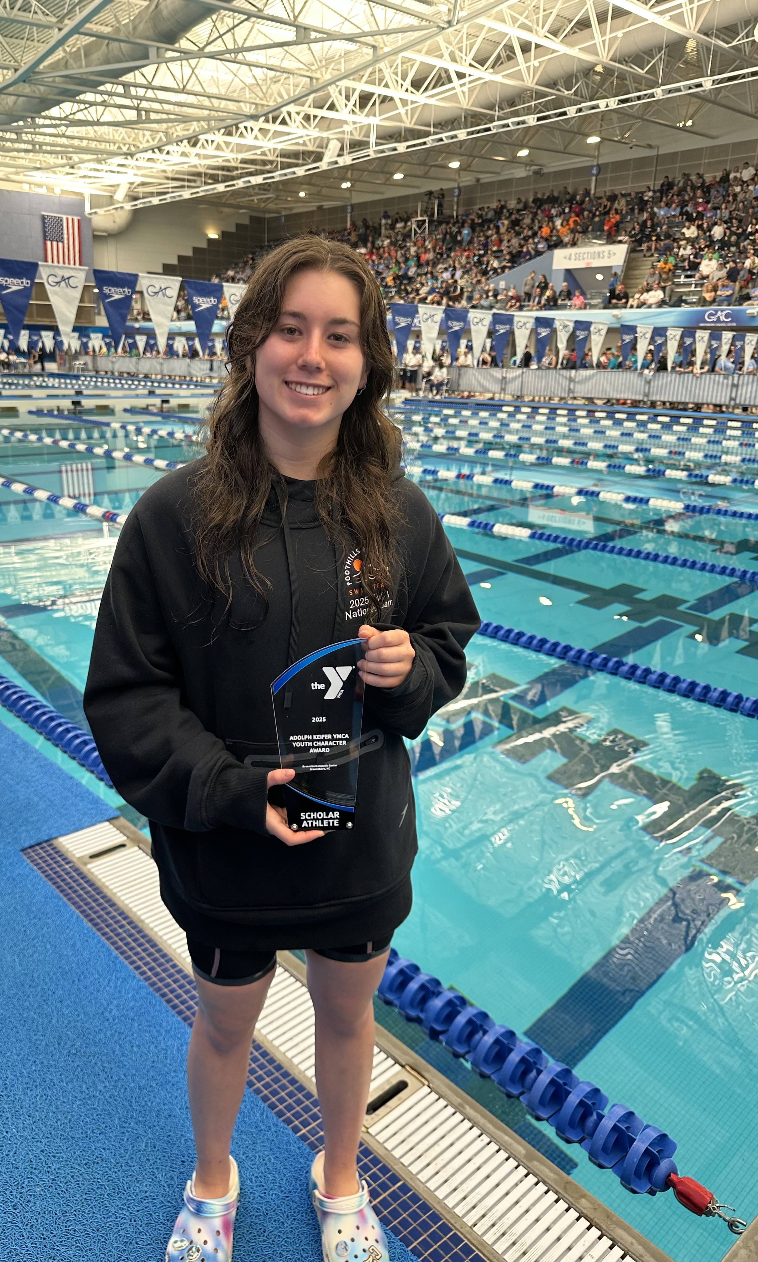 Chelsea Burkhart poses with her award